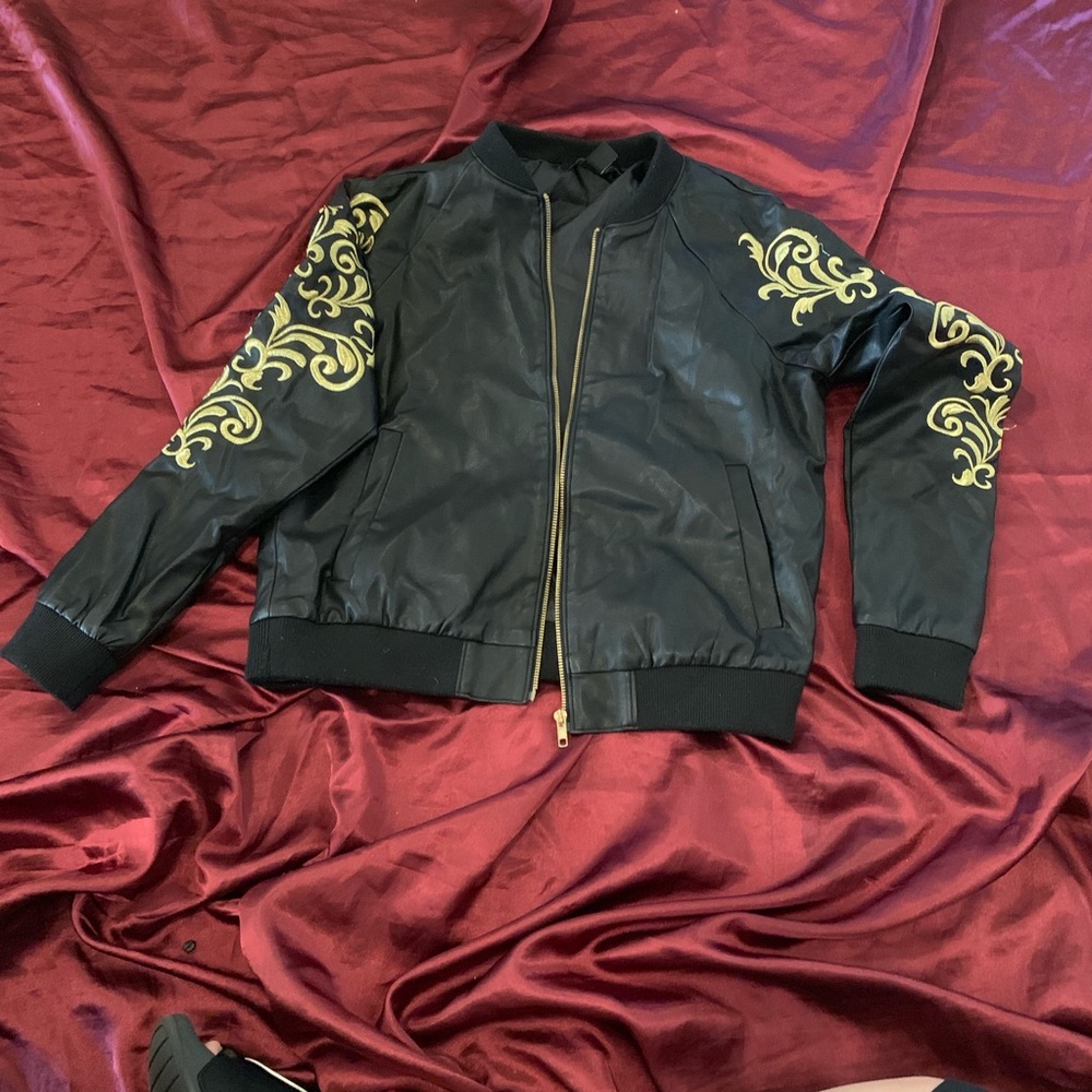 Leather jacket with beautiful gold details.